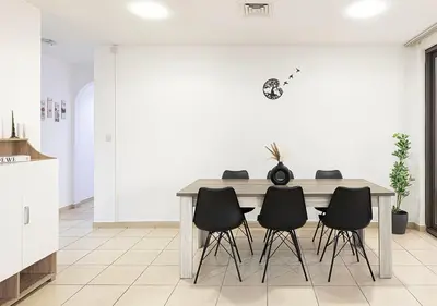 a dining room with a table and chairs at 2 min walk to JBR Beach & Dubai Marina - Sea View in Dubai
