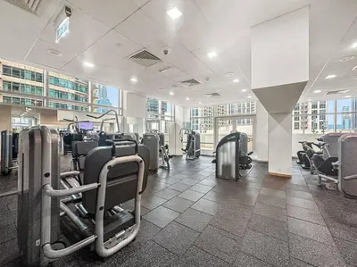 a gym with rows of chairs in a building at FIRST CLASS 1BR Modern Downtown Oasis in Dubai