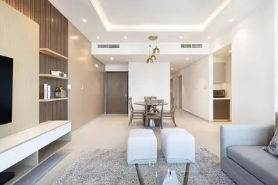 a living room with a couch and a table at 2Bed-400m from Burj Khalifa- Heart of Dubai in Dubai