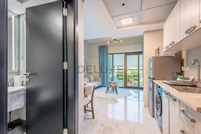 a kitchen with a door leading to a living room at Charming 2BR at MAG 515 Dubai South by Deluxe Holiday Homes in Dubai