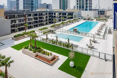 an aerial view of an apartment complex with a pool at 1BR Gem in JVC Pool, Gym, BBQ & Balcony in Dubai