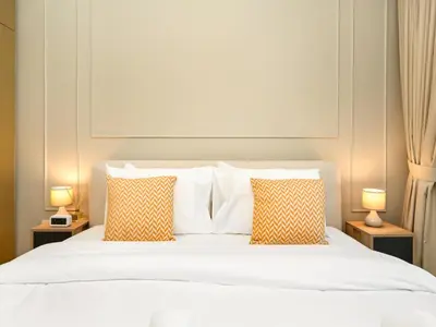 a bedroom with a white bed with two lamps at Brand New! Dubai Eye & JBR Beach Panorama! in Dubai