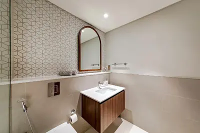 a bathroom with a sink and a mirror at Vida Creek Beach 1 Bedroom in Dubai