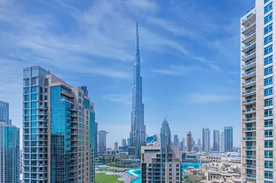 a view of a city skyline with a tall skyscraper at Savis Homes - Luxury 2 Bedroom Suite with Full Burj Khalifa View in Dubai
