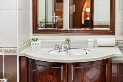 a bathroom with a sink and a mirror at Spacious 3 BR Newly Furnished - Dubai Marina in Dubai