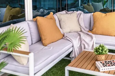 a porch with a couch and a coffee table at Spacious 3 BR Newly Furnished - Dubai Marina in Dubai
