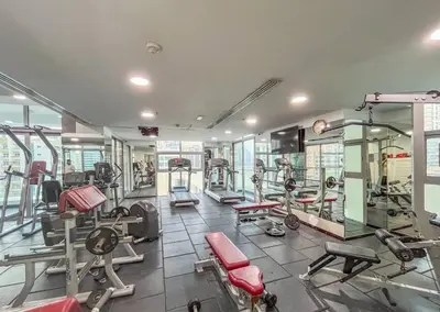 a gym with treadmills and machines in a building at Royal King Size Stay 2BR With Marina View in Dubai