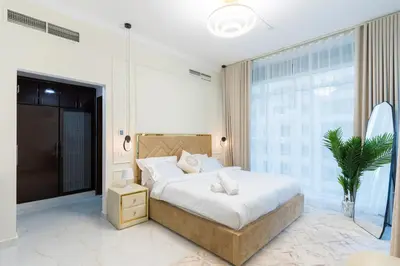 a bedroom with a large bed and a large window at Luxury 3BR with Stunning Full Marina View in Dubai in Dubai