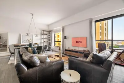 a living room with two leather couches and a table at GuestReady - Serene retreat with Ain Dubai Views in Dubai