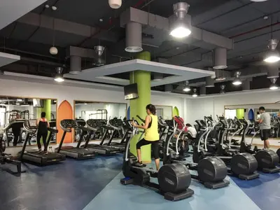 a group of people exercising in a gym at GuestReady - Serene retreat with Ain Dubai Views in Dubai