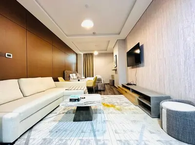 a living room with a couch and a table at Airvistas CityNest Retreat at Business Bay, Dubai in Dubai