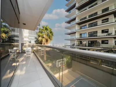 a balcony with a view of a building at Chic 1 Bed Getaway in Al Jaddaf Easy City Access in Dubai