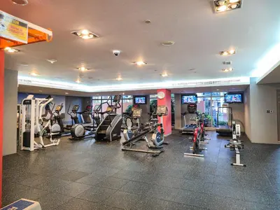 a gym with treadmills and machines in a building at EasyGo- amazing 1bdr with view south ridge- downtown in Dubai