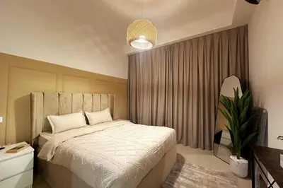 a bedroom with a bed and a potted plant at Stunning Newly Furnished Apartment Dubai Marina in Dubai