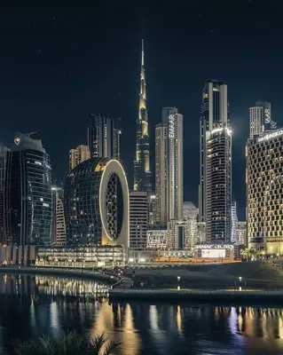 a night view of a large city with a skyline at Capsule Hostel Room in Business Bay Near Downtown in Dubai