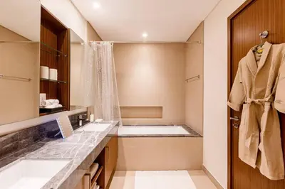 a bathroom with two sinks and a tub at Large 2BR with Marina and Sea View in 5242 Tower - EE Holiday Homes in Dubai