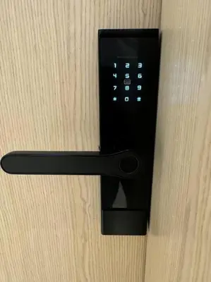 a black remote control hanging on a wall at Luxury Apartment in Oakley Square Residences, JVC in Dubai