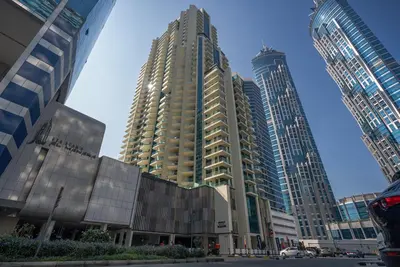 a group of tall buildings in a city at Luxury 1 & 2 BHK Apartments, Branded & State of The Art Amenities in Dubai