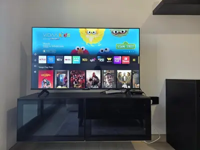 a flat screen tv sitting on top of a desk at 1 Bed Retreat- RBE Vacation Homes-Binghatti Luna in Dubai