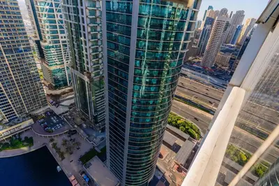 an aerial view of a tall building in a city at JLT Studio apartment Goldcrest Executive in Dubai