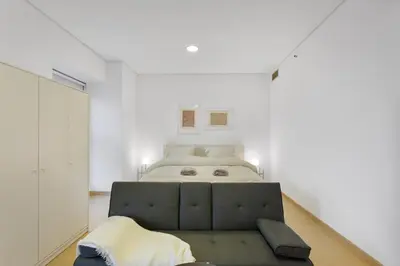 a bedroom with a large bed in a white room at Dubai Marina FLOOR 89 - AMAZING VIEWS in Dubai