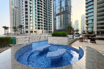 a swimming pool in a city with tall buildings at Dubai Marina FLOOR 89 - AMAZING VIEWS in Dubai