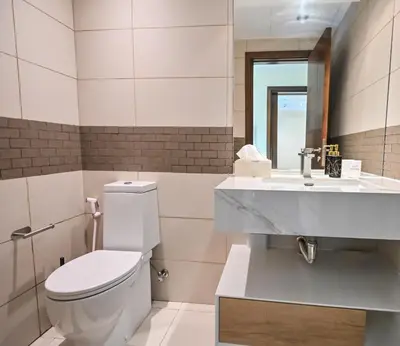 a bathroom with a toilet and a sink at Luxury 1 Bed with full Marina View - Emaar Park Island in Dubai