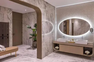 a bathroom with a sink and a mirror at Highest Infinity Pool Burj Khalifa View in Dubai