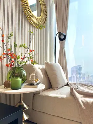 a living room with a couch and a mirror at Highest Infinity Pool Burj Khalifa View in Dubai