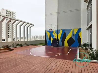 a basketball court on a balcony of a building at Blissful One Bedroom Apartment in Dubai