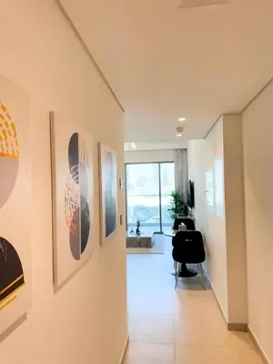 a hallway with art on the walls of a house at INA HOMES - 1BHK Downtown Views Direct Access to Dubai Mall in Dubai