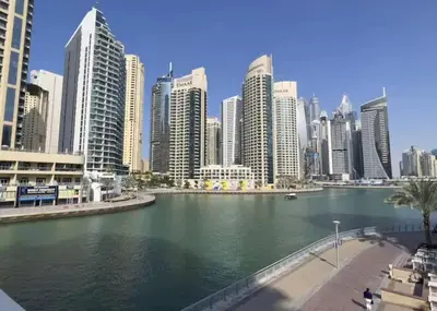 a view of a large city with tall buildings at Royal Marina Experience Lavish 2BR Waterfront View in Dubai
