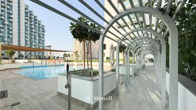 an archway in a building with a pool at 1BR Apt Near Downtown Dubai with Pool & Skyline Views in Dubai