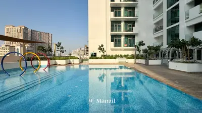 a swimming pool in the middle of a building at 1BR Apt Near Downtown Dubai with Pool & Skyline Views in Dubai