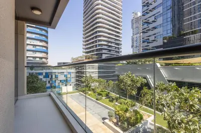 an apartment balcony with views of the city at Livbnb - 2B Maid's in Dunya, 5Min Walk to Dubai Mall in Dubai
