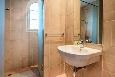 a bathroom with a sink and a shower at Beautiful 2BR Villa in JVT in Dubai