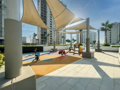 a pavilion in a city with buildings in the background at Elegant Studio in Azizi Riviera with Luxury Amenities in Dubai