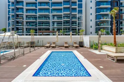 a swimming pool on the roof of a building at GuestReady - Elegant living in Downtown Dubai in Dubai