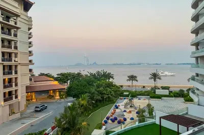 a view of the ocean from the balcony of a resort at Livbnb-Premium 1B with BurjAlArab Views in Mina in Dubai