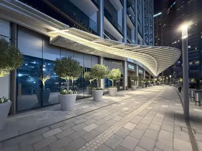 a hallway of a building with potted trees on it at The View of a Lifetime - Luxury Living with Full Burj Khalifa & Fountain Show in Dubai