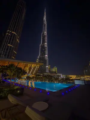 a view of the burj khalifa at night at Iconic Views - Exclusive Burj Khalifa & Fountain Views from Every Angle in Dubai
