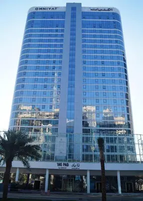 a tall building with a sign in front of it at DownTown, Amazing Business Bay Skyline Views in Dubai
