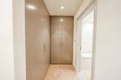 a hallway with a door with a sign on it at Forte Luxe - Stylish 2BR Downtown Escape in Dubai