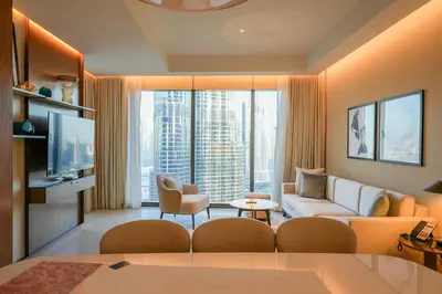 a living room with a couch and a tv at 3 BHK Luxury Living at The Address Opera in Dubai