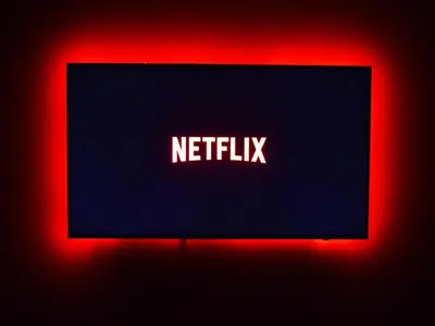 a sign with the word netflix on it at Chic Modern Studio in Luma21, Best Pool & Gym in JVC Dubai in Dubai