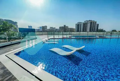a swimming pool on top of a building at Bloomfields Luxury Escape Studio In Samana Golf in Dubai