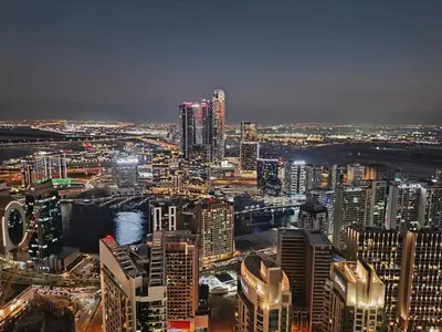 a view of a city at night at Stunning 2BR Apt Burj Royale 10 mins walk to Dubai mall in Dubai