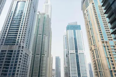 a group of tall buildings in a city at Cosy Apartment Marina Gate in Dubai
