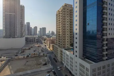 an aerial view of a city with tall buildings at Frank Porter - Dezire Residences in Dubai