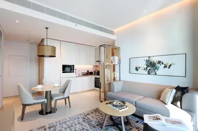 a living room with a couch and a table at Stunning 1BR with Marina View And Beach Access in Dubai